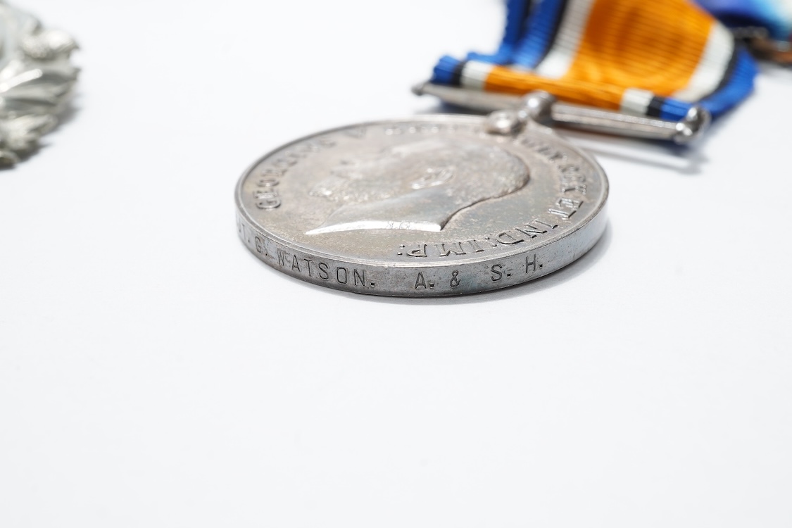 A First World War medal trio awarded to 2140 SJT. G. Watson. Argyll and Sutherland Highlanders, together with the related cap badge and two photographs of Watson in Highlanders uniform and printed as postcards